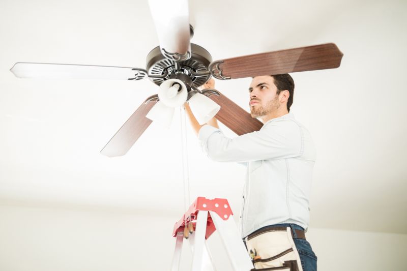 Technician Inspecting a Fan